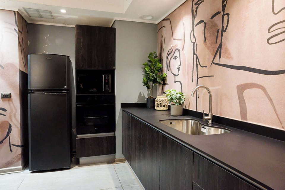 Stylish and modern kitchen with artistic flair, perfect for culinary adventures in your cozy Chilean studio.