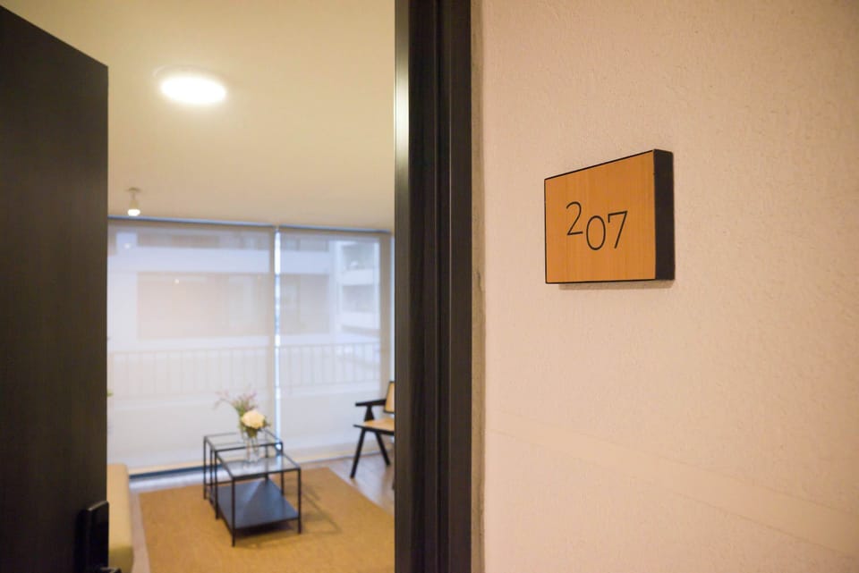 Step into a cozy retreat with modern furnishings and a welcoming ambiance, perfect for relaxation.