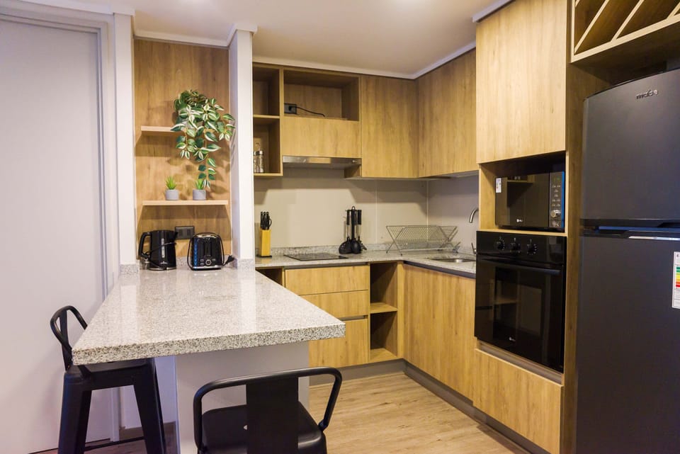 Cozy and modern kitchen with all essentials for a delightful cooking experience in your private studio.
