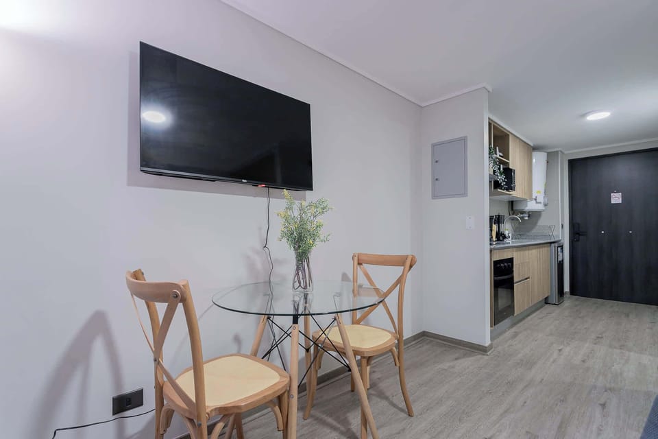 Cozy dining nook with modern amenities, perfect for enjoying meals while watching your favorite shows.