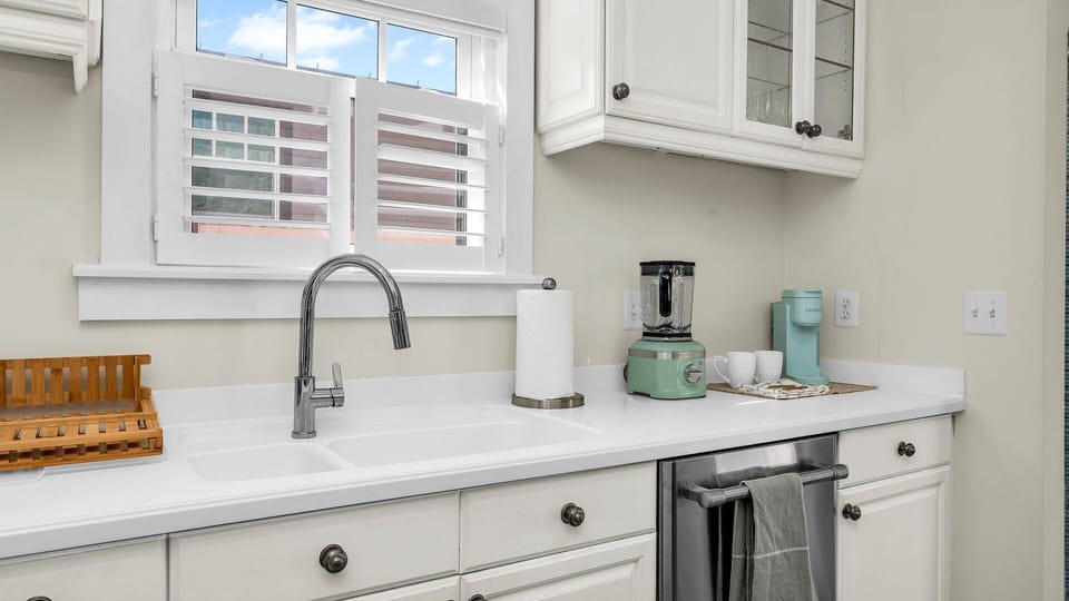 Cook in style! This fully-equipped kitchen features an Italian gas-range stove, Keurig coffee maker with complimentary coffee, toaster, blender, and service-ware for 6—perfect for indoor and outdoor dining.