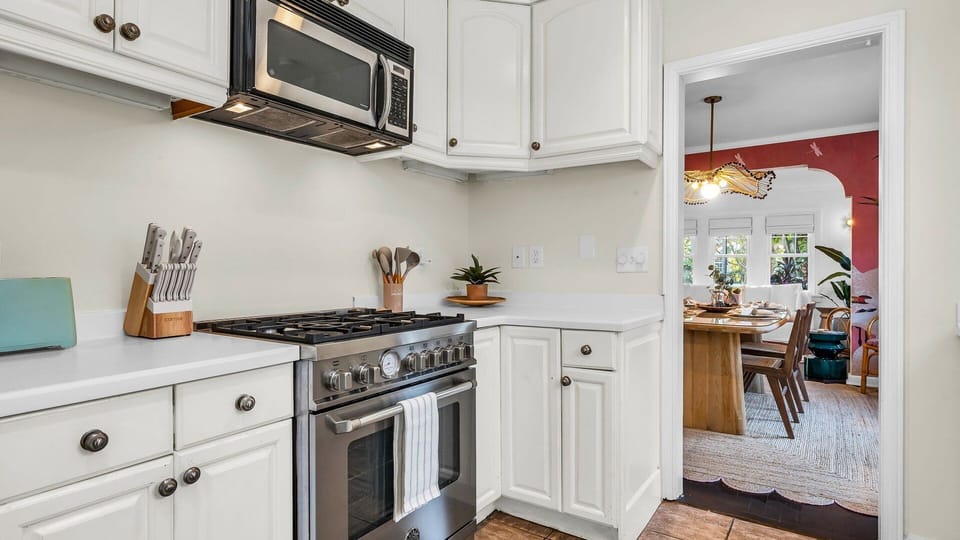 Cook in style! This fully-equipped kitchen features an Italian gas-range stove, Keurig coffee maker with complimentary coffee, toaster, blender, and service-ware for 6—perfect for indoor and outdoor dining.