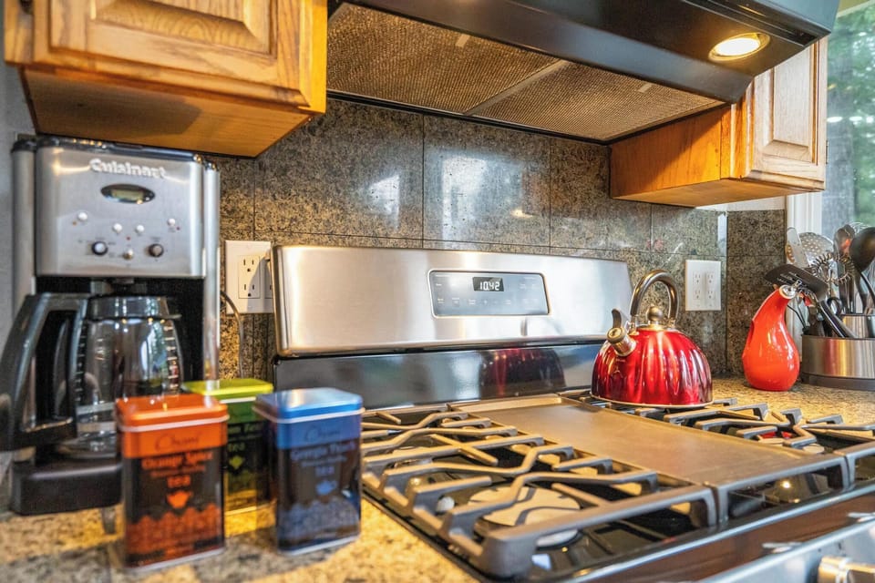 Our coffee cupboard is stocked with complimentary coffee, tea, creamer and sugar. The gas stove is a chef's dream.