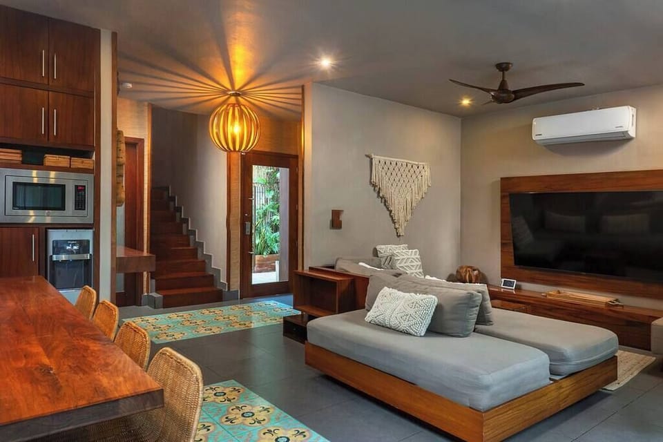 Beautifully decorated armchair coordinated with the rest of the spaces and with a TV