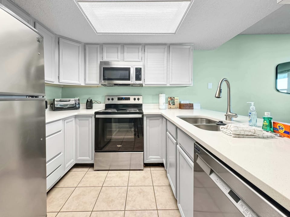The open kitchen offers ample space & all the comforts of home