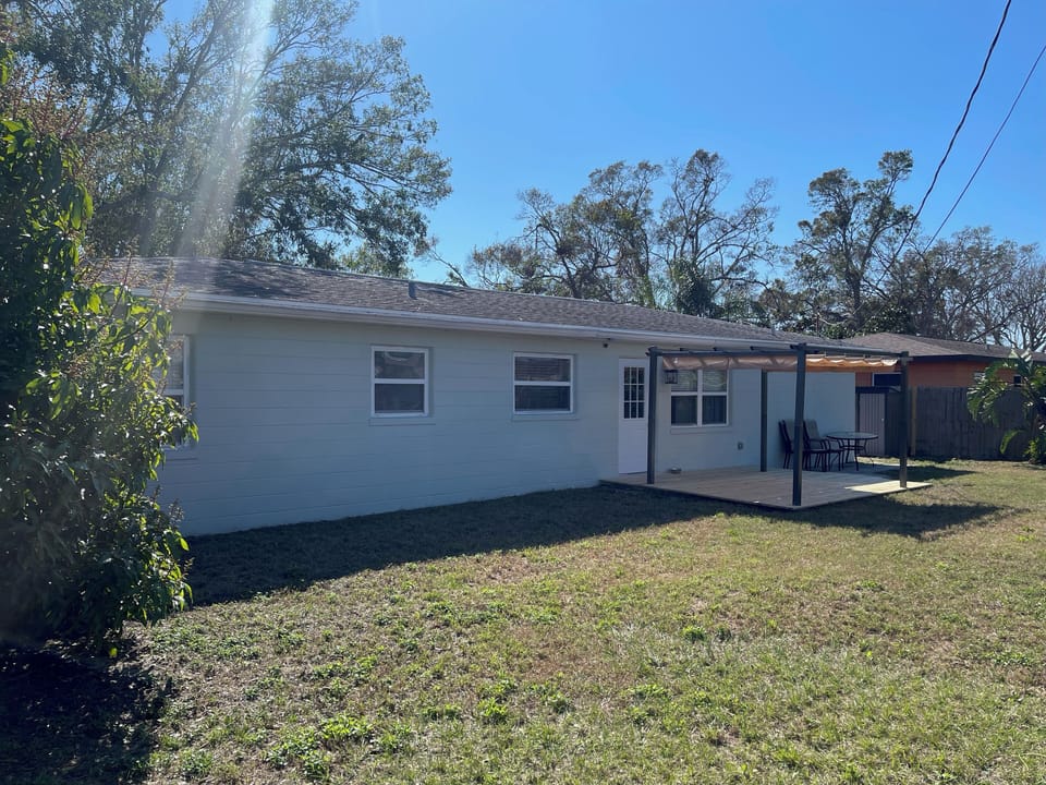 Large fenced-in backyard. Pergola and new patio table now available!  