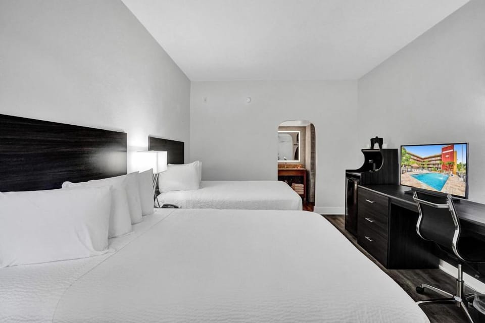 Settle in comfortably with two beds and an in-room workspace.