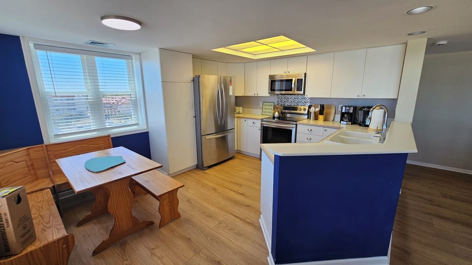 Fully equiped kitchen with newer stainless steel appliances including dishwasher