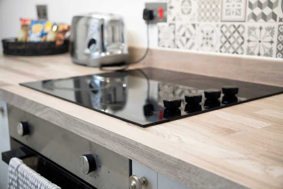 Family-friendly kitchen oasis equipped with all essentials, including a washer & dryer, oven, fridge and full cookware set. 