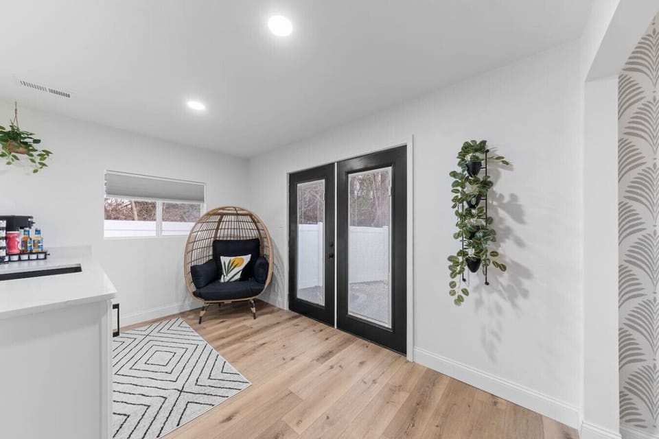 Indulge in your own private coffee bar right in the master bedroom, complete with a sink and custom quartz countertop! ☕️✨ French doors open to the backyard, leading to private patio just two steps down. It’s the perfect spot for relaxation! 🌿🌟🛏️