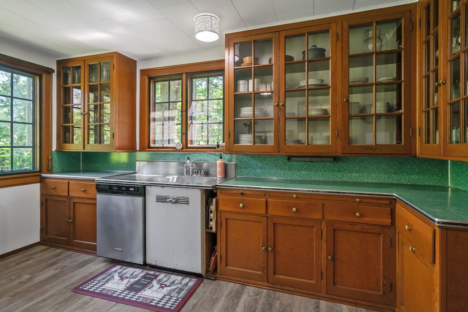 The kitchen is very well stocked with plenty of dishes and a dishwasher.