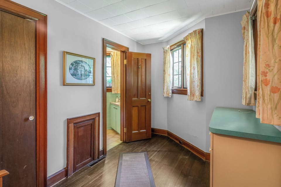 Full bathroom through kitchen