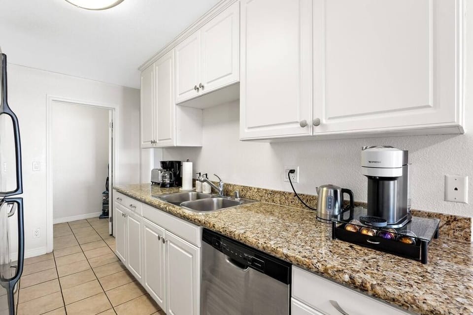 Fully equipped kitchen with granite counters for your culinary needs.