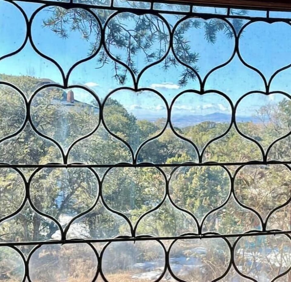 Hand cut, leaded glass and stained glass throughout CASA and Casita