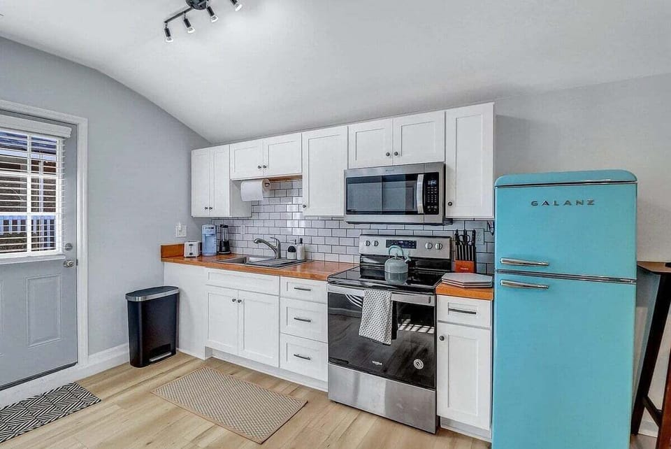Whip up something special in this charming kitchenette—small in size but big on character and fully equipped for your culinary needs!