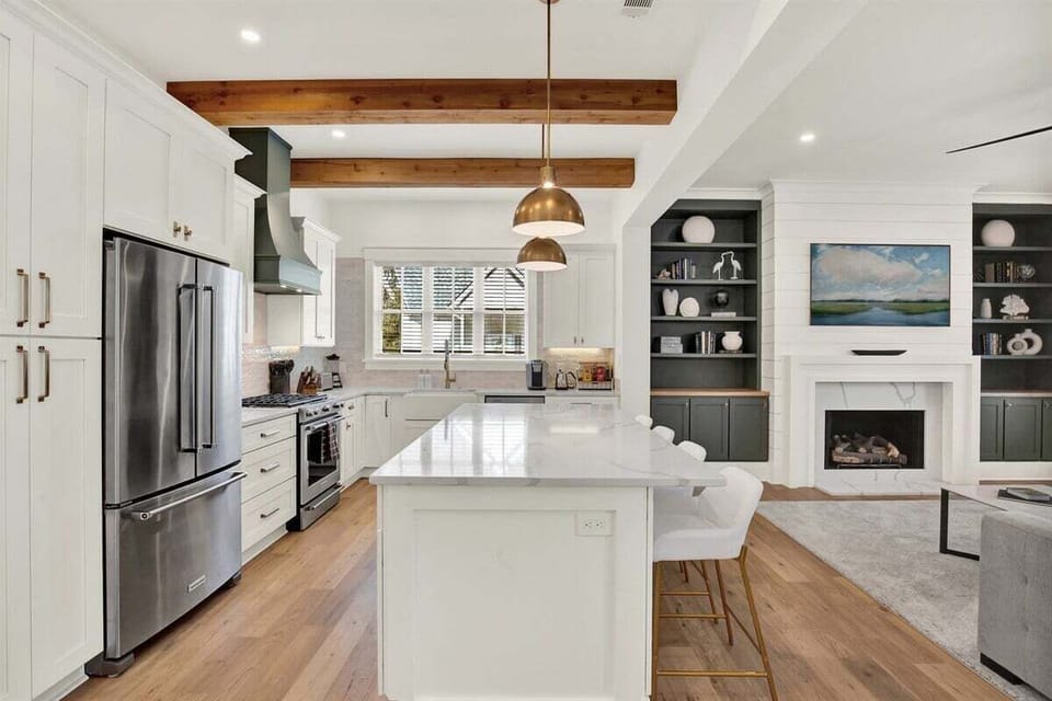 With gorgeous wood beams, stone countertops, and a fully stocked setup, this space is perfect for whipping up meals, gathering with loved ones, or sipping your morning coffee.