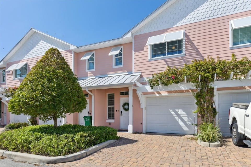 Say hello to Cape Crossing 103, your charming pink townhome just steps from the marina and adventure.