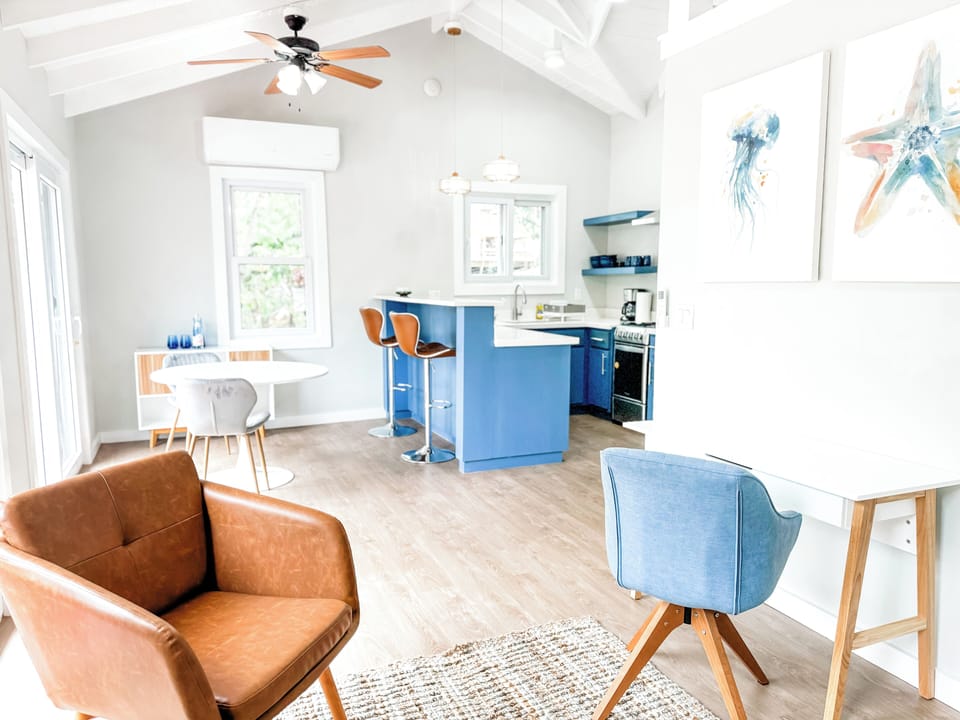 View of the dining area and kitchen from the living room.