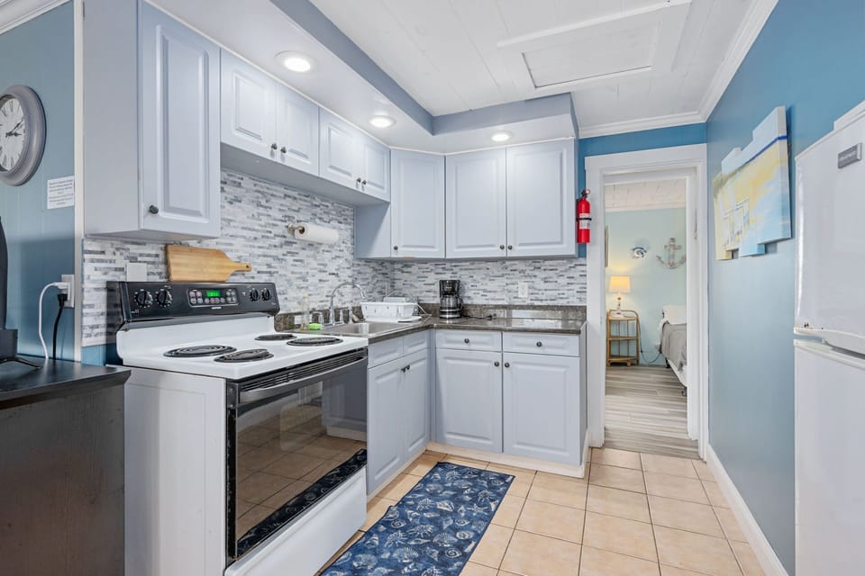 Updated kitchen with apartment sized fridge and full stove/oven