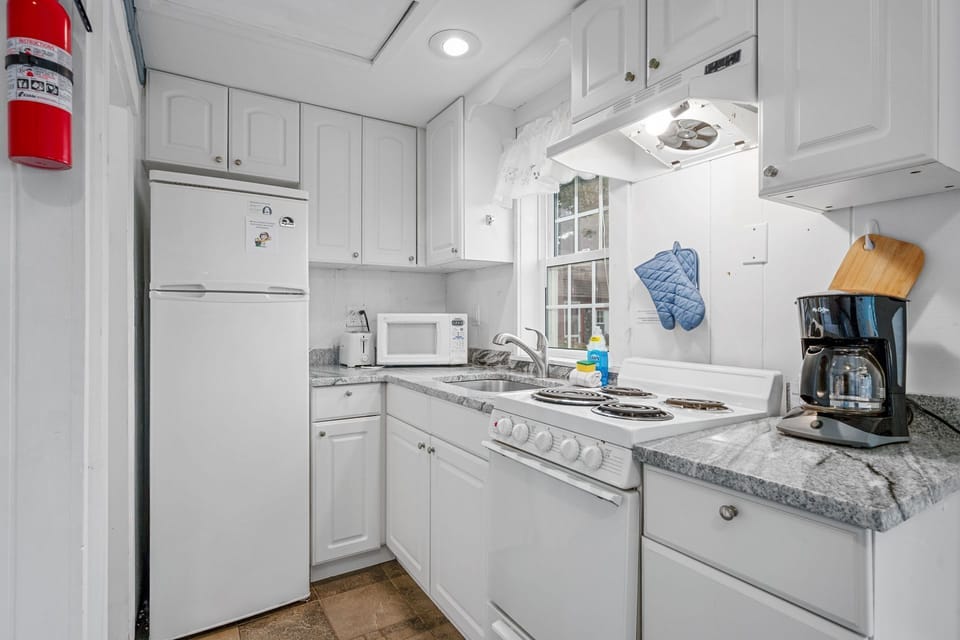Kitchen with stove/oven and  fridge,