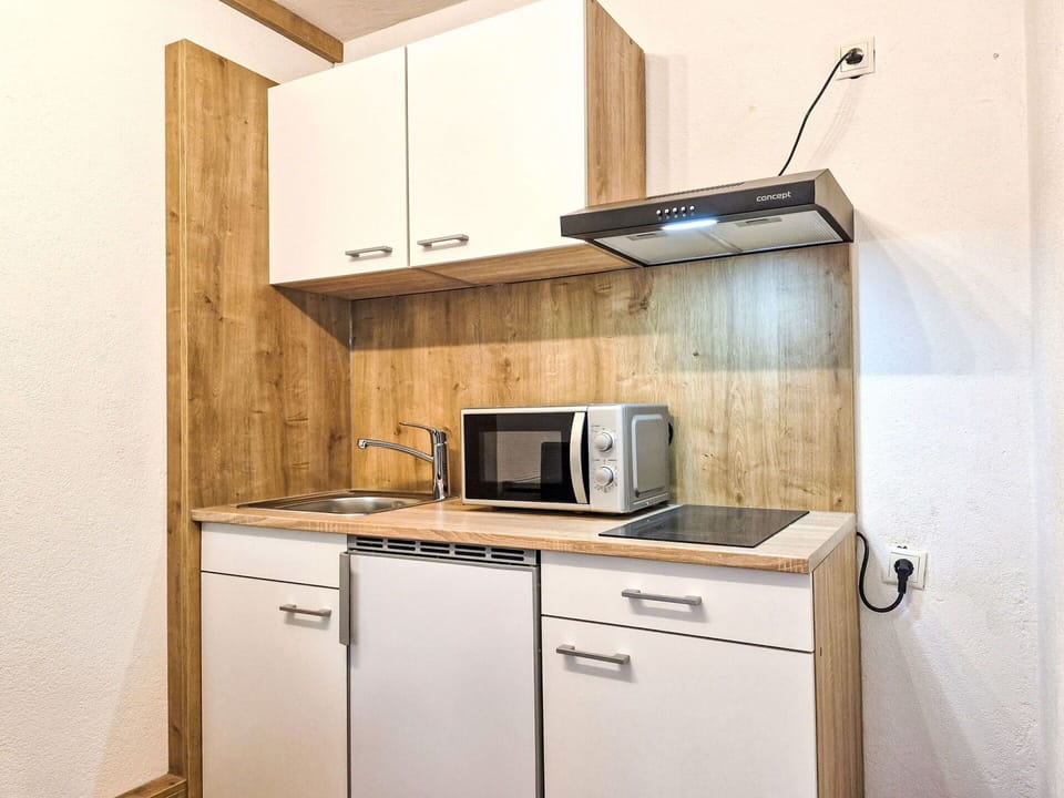 Wood, Interior Design, Flooring, Furniture, Floor, Cabinetry, Room, Countertop, Wood Stain, Sink