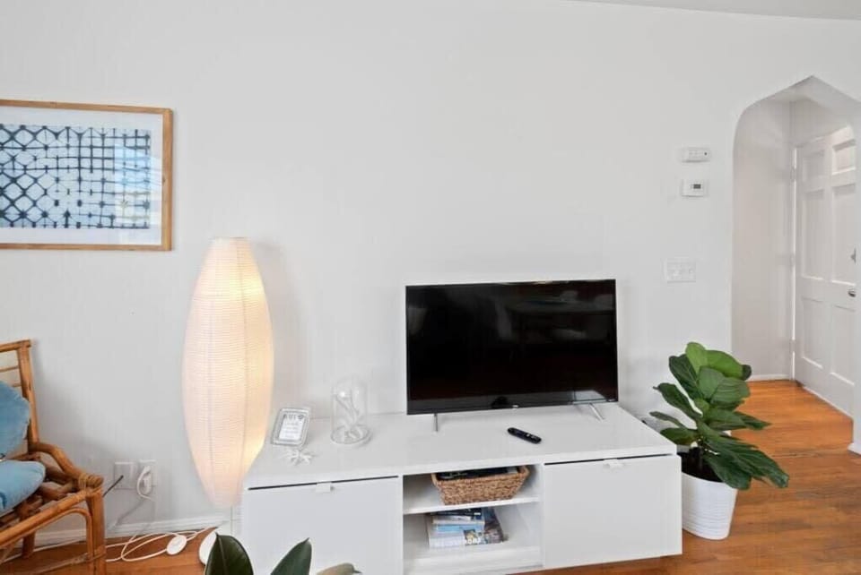 32 inch Smart T.V streams all your favorite shows. Portable AC in living room. 