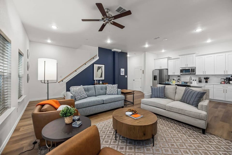 Relax in Style: Plush sofa and chairs, perfect for unwinding. The sofa doubles as a queen sleeper for extra comfort.