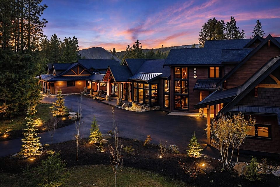 Grand Retreat - This 10 bedroom home lights up the evening sky with warm timber details and driveway space for up to 10 vehicles.