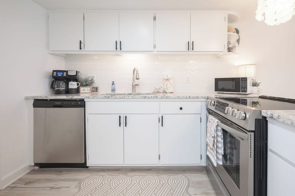 Bright and spacious kitchen with plenty of natural light—perfect for cooking, gathering, and enjoying the coastal vibes