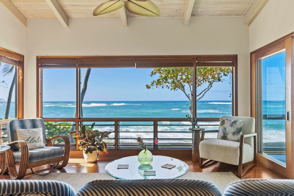 Unwind in the lounge room with panoramic ocean views and plenty of natural light.
