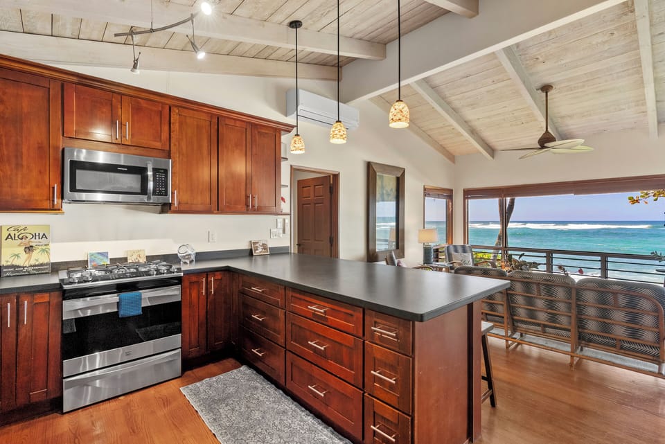 Open-concept kitchen with bar seating, ideal for casual breakfasts or evening cocktails.