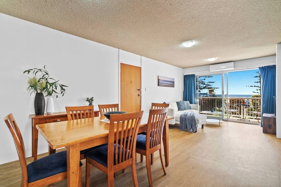 Gather around the wooden table for a hearty meal, a lively chat, or a competitive board game night with loved ones.