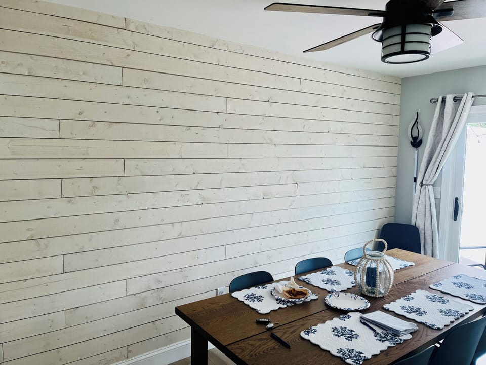 Dining table/room overlooking deck. Seats 8, room for high chair (we have one!)