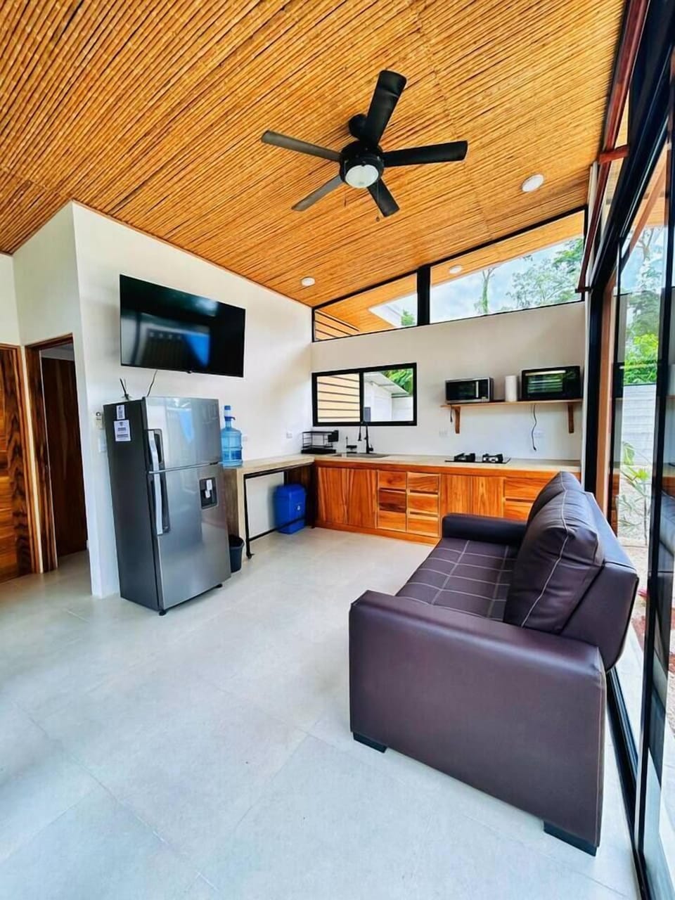 Kitchen and mini living room with TV