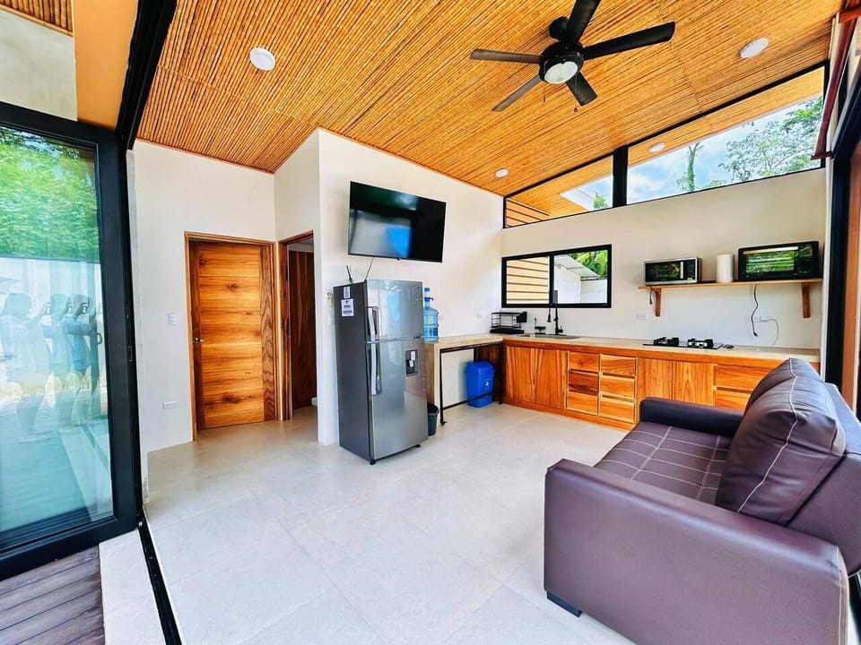 Equipped kitchen and mini living room with TV