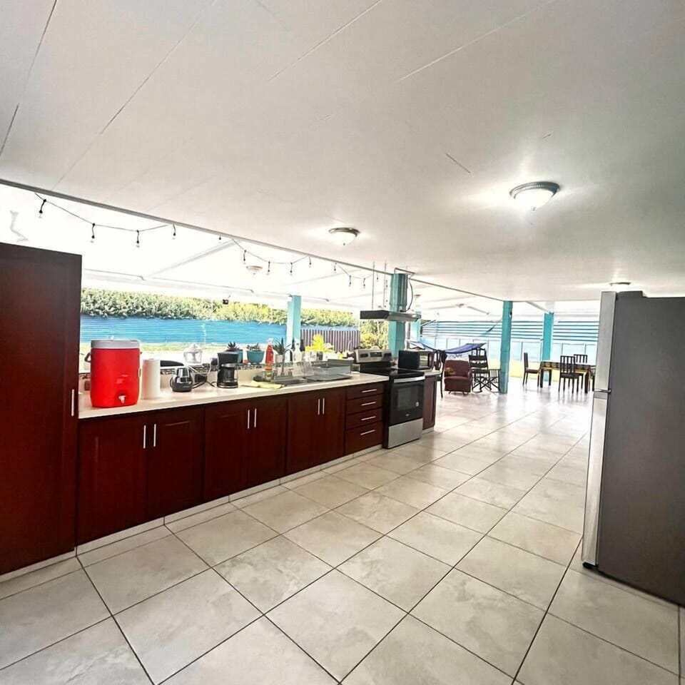 Fully equipped kitchen surrounded by a covered terrace