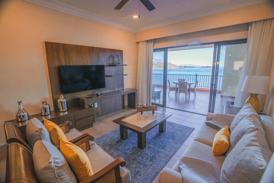 Living room with Queen sleeper sofa, access to private veranda and views!