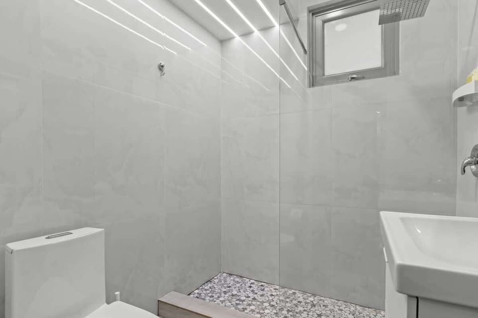Elegant and modern aesthetic of the space creates a serene atmosphere, making it the ideal place to unwind after a long day.