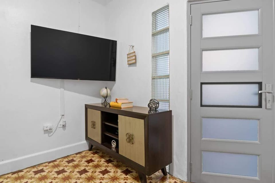 Relax in our cozy living area, equipped with a flat-screen TV for your entertainment.
