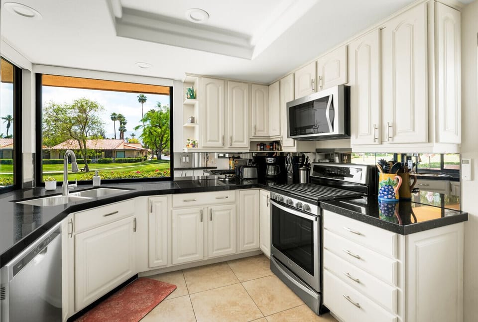 Chic black and white kitchen with efficient, space-saving design.