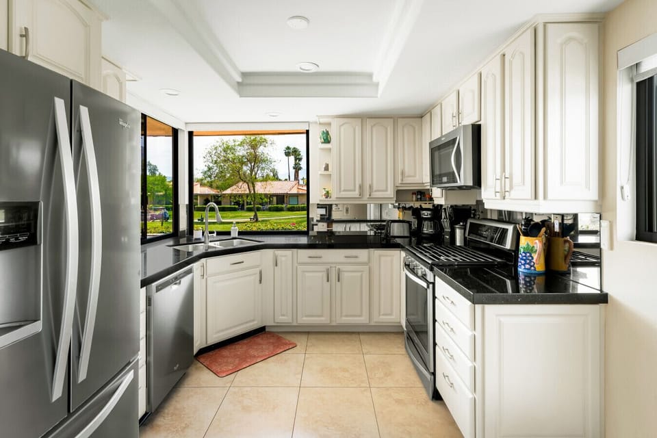 Chic black and white kitchen with efficient, space-saving design.