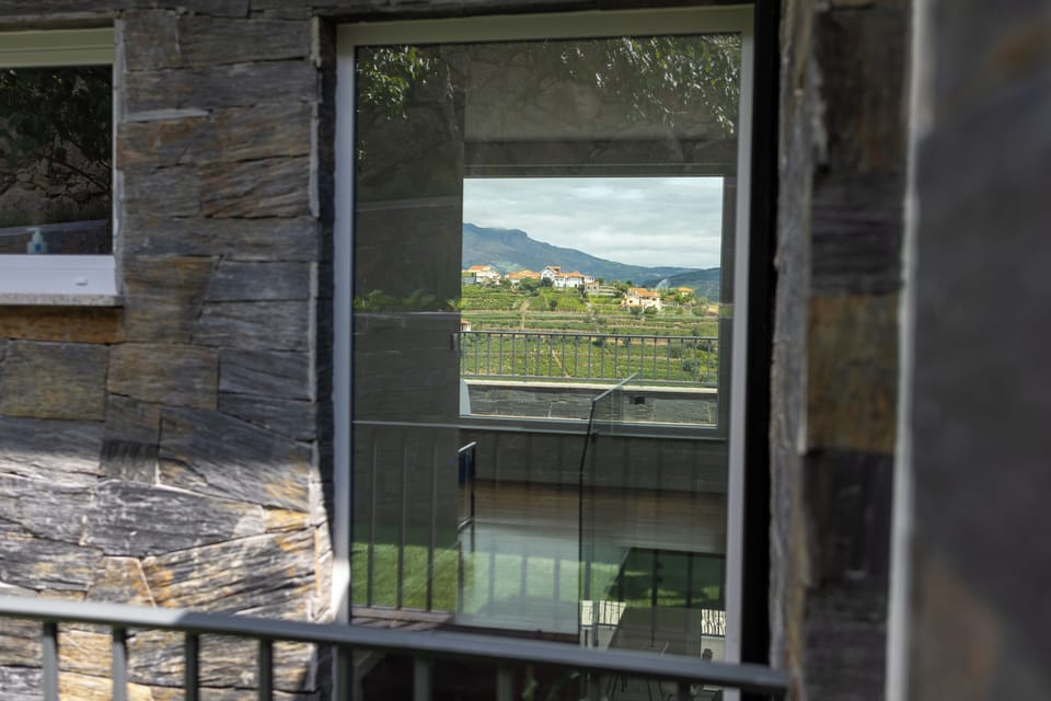 The Marão mountain framed beautifully by the two grand windows of the staircase.