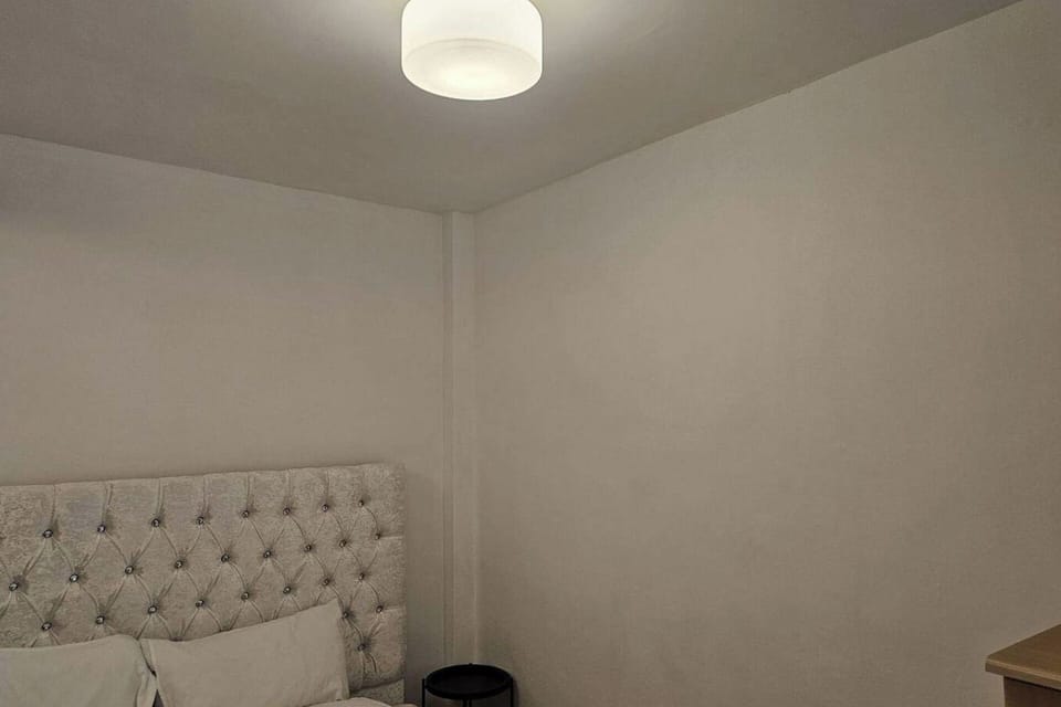 The bedroom area of this apartment is designed with your relaxation in mind. Featuring a plush, comfortable bed with soft linens and cozy pillows, it's the perfect place to unwind after a long day.
