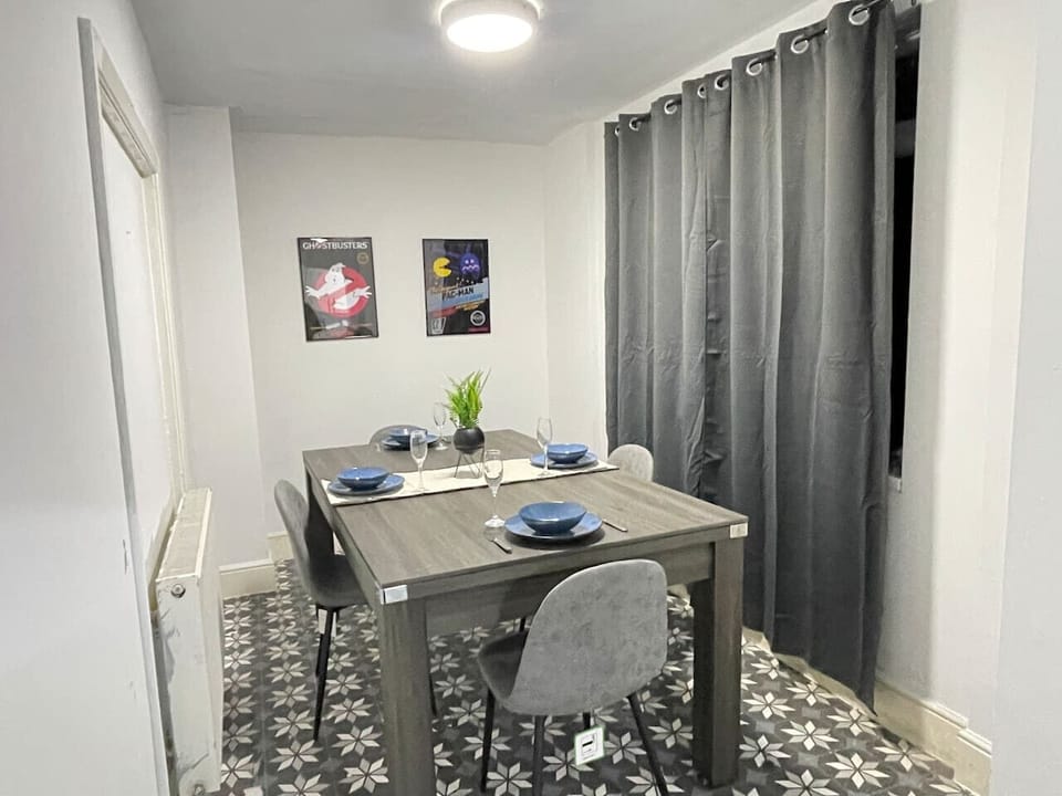 This contemporary dining area combines functionality and style, offering ample space for meals and a cosy ambiance for memorable dining experiences.