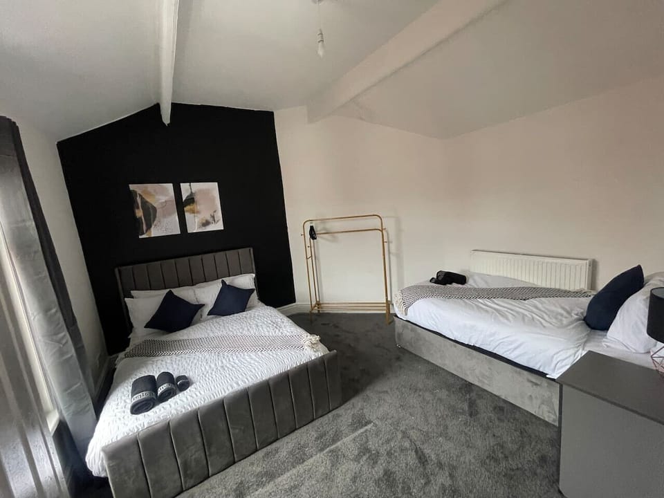 A serene bedroom space designed with natural materials and calming colors, providing a peaceful ambiance for rest and rejuvenation.