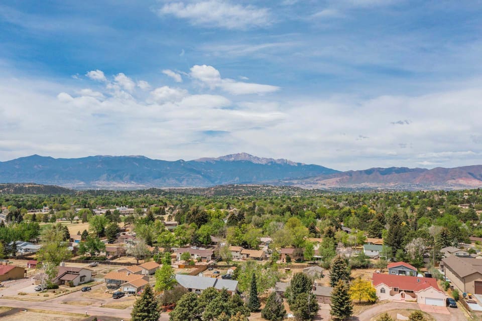 Experience breathtaking, unobstructed vistas of the Colorado Front Range directly from your private deck. This expansive view overlooks the peaceful neighborhood and offers a stunning backdrop for morning coffee or sunset watching.