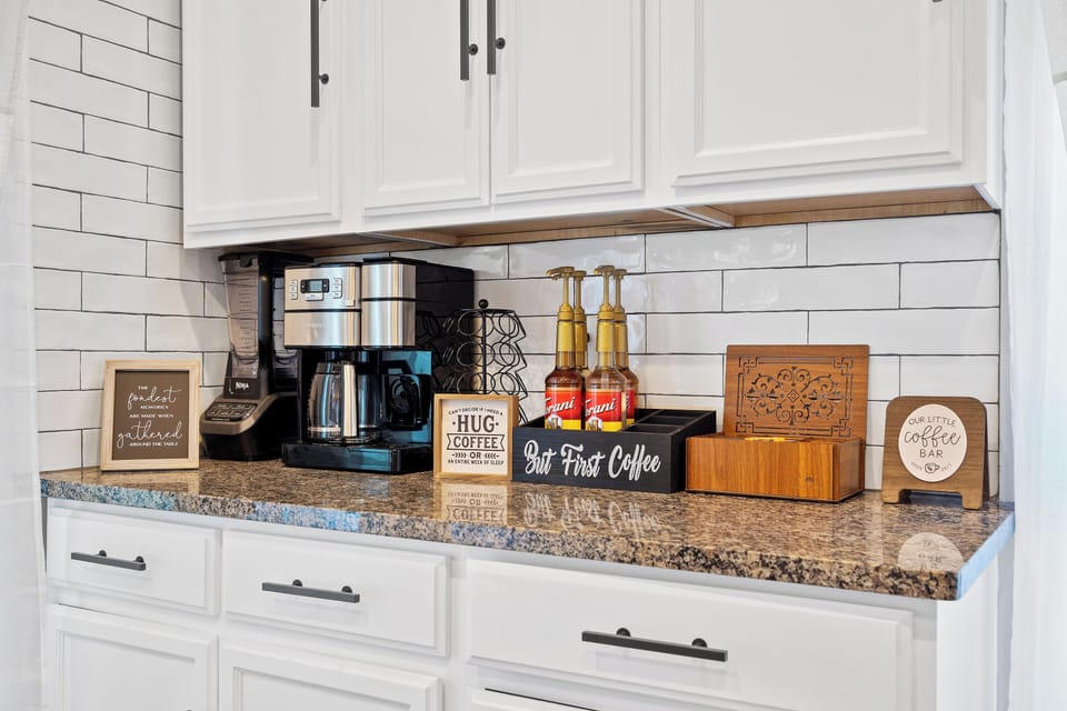Dedicated coffee bar with drip and pod options, perfect for starting your day before walking to Westport or catching the nearby Main Street Streetcar.