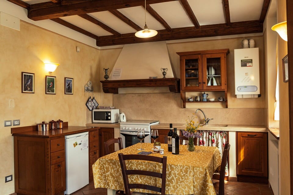 Furniture, Kitchen, Interior Design, Countertop, Flooring, Kitchen Appliance, Cabinetry, Wood, Major Appliance, Ceiling