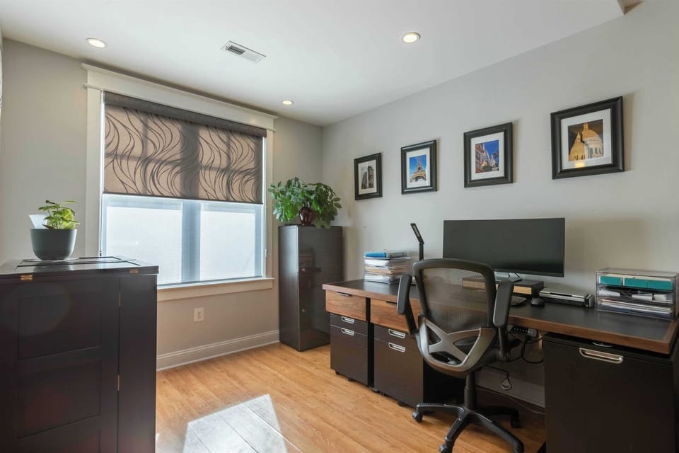 Office space with 7-ft desk with motorized lift and 34" curved monitor