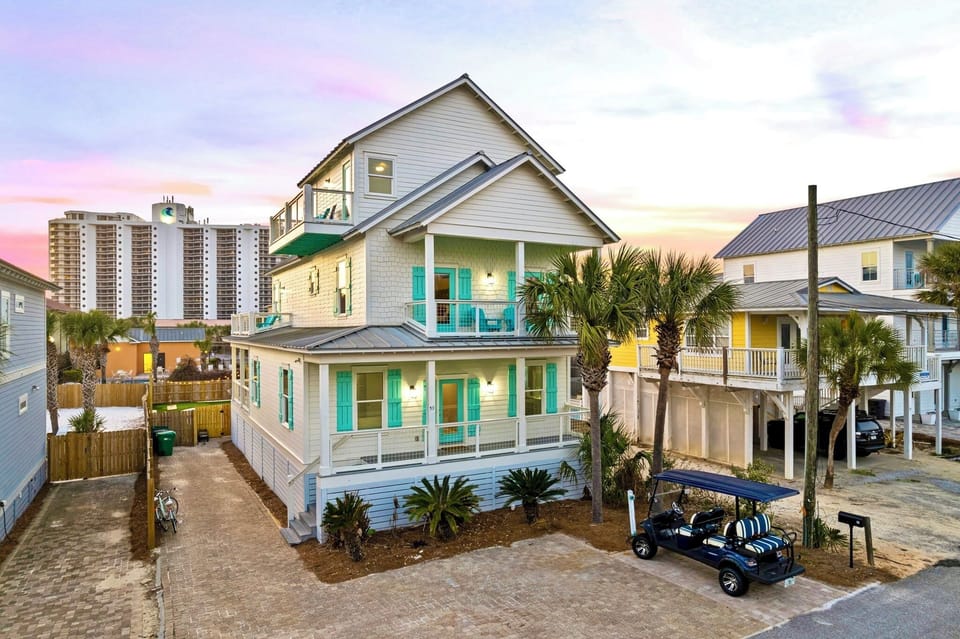 Tidepool - 100 yards to the beach and FREE golf cart included! Private backyard oasis with heated pool, putt-putt, lounge chairs, hammock, outdoor kitchen, fire pit, and corn hole.